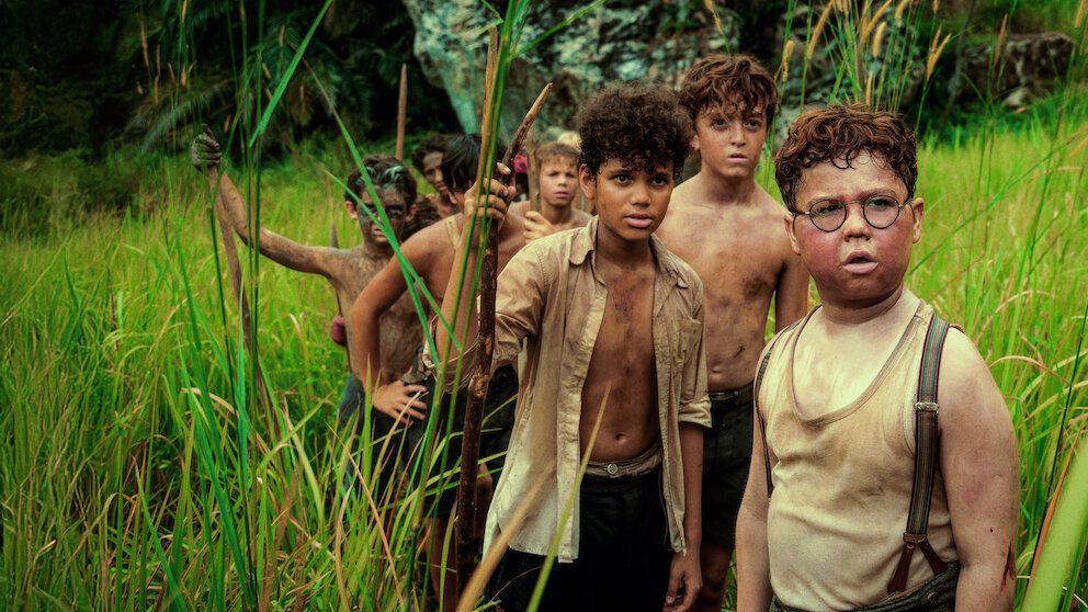 Lord of the Flies Netflix series boys on island holding spears survival scene