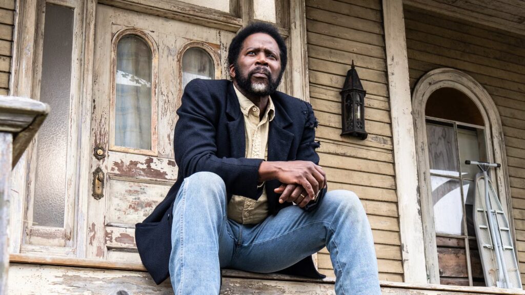 boyd-sitting-on-the-colony-house-porch-in-from-season-4
