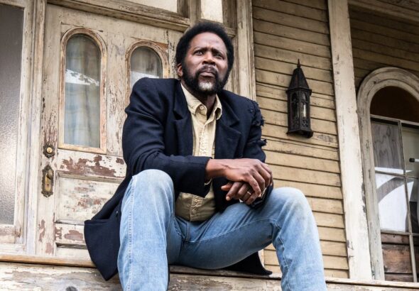 boyd-sitting-on-the-colony-house-porch-in-from-season-4