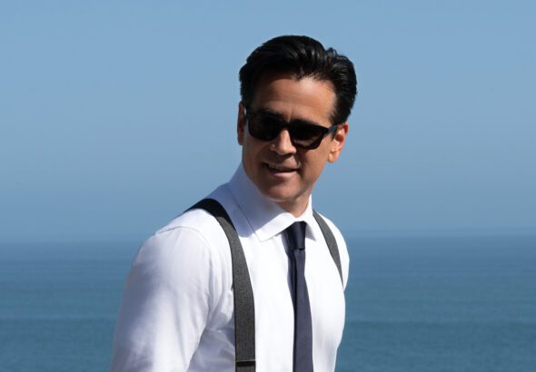 Sugar Season 2 promotional image showing a detective in sunglasses standing near the ocean.