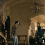 Residents stand inside Colony House during a tense moment in FROM Season 4 Episode 8.