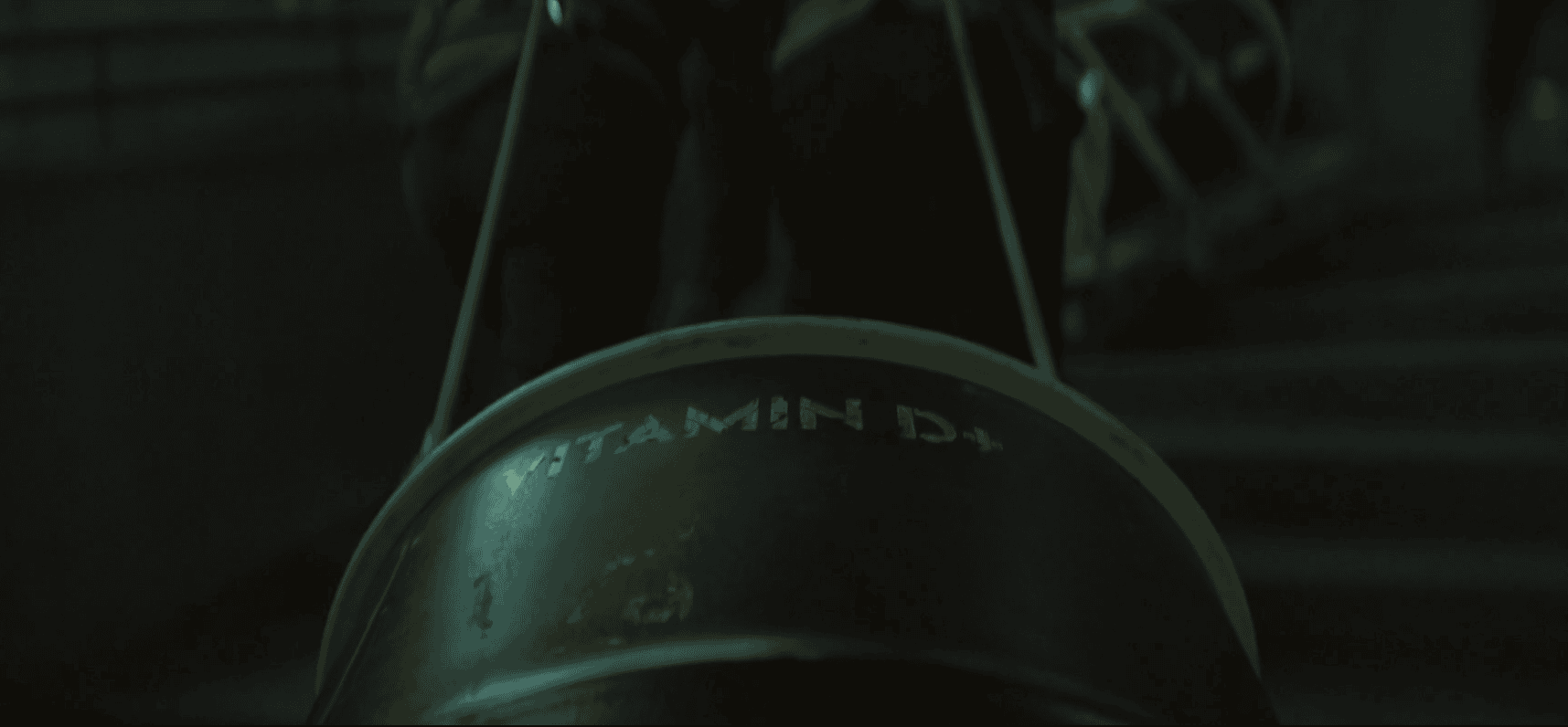 A Vitamin D+ barrel being carried through Silo 18 in Silo Season 3 Episode 2.
