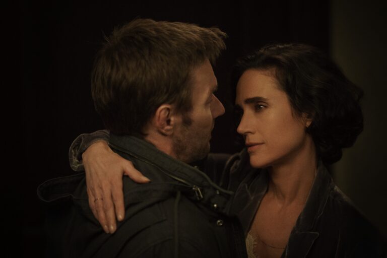 Jason Dessen and Daniela embrace as she looks into his eyes in Dark Matter.