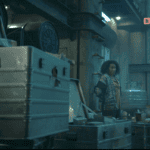 Carla standing among empty storage cases in Critical Supply in Silo Season 3 Episode 5.