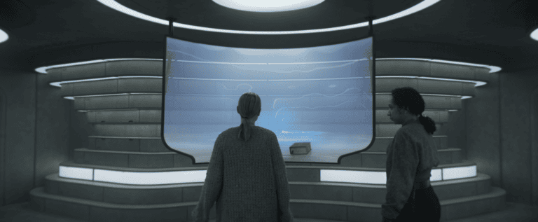Juliette Nichols and Martha Walker examine the Silo 17 schematic in Silo Season 3 Episode 6
