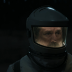 Patrick Kennedy wearing a cleaning suit outside Silo 18 in Silo Season 3 Episode 7