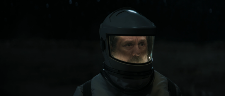 Patrick Kennedy wearing a cleaning suit outside Silo 18 in Silo Season 3 Episode 7