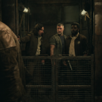 Harwood walks away as Billings and the others discover his hidden elevator beneath the Mines in Silo Season 3.