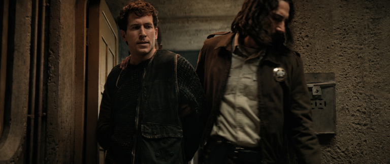 Sheriff Billings escorts Mike Davidson into custody for Orla Kent’s murder in Silo Season 3.