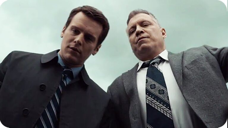 Two FBI agents from Netflix’s Mindhunter look down toward the camera in a scene from the crime drama series.