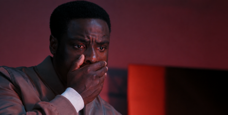 Leighton covers his mouth with his hand, looking distressed in Dark Matter Season 2 Episode 9.